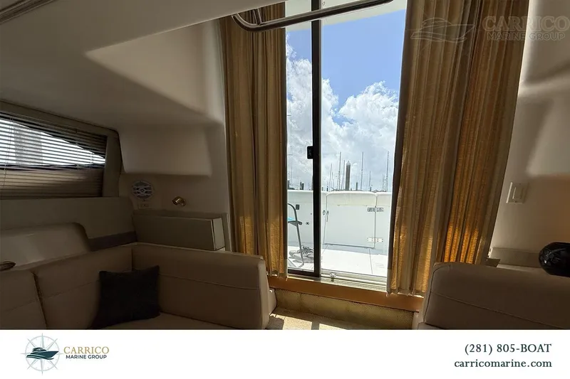 Slide: The Image of Interior view of 2000 Carver 350 Mariner yacht with sliding glass door and curtains. - 22