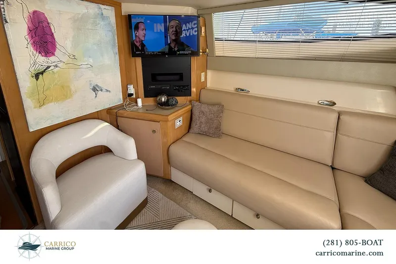 Slide: The Image of Interior of 2000 Carver 350 Mariner yacht with modern seating and wall art. - 26