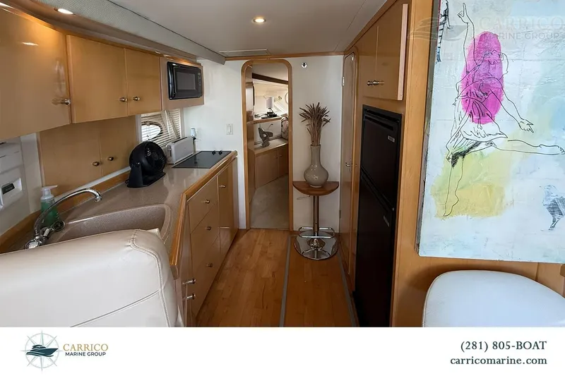 Slide: The Image of Interior of 2000 Carver 350 Mariner yacht with modern kitchen and artwork. - 27