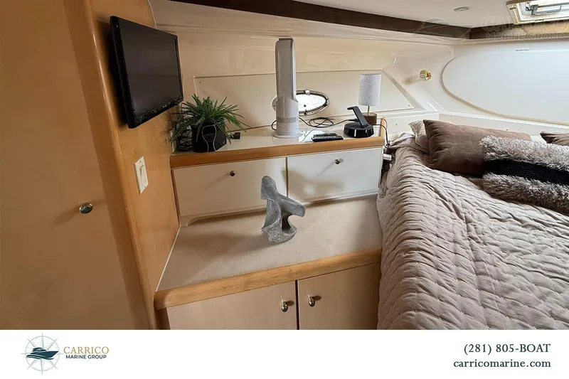 Slide: The Image of Interior of 2000 Carver 350 Mariner yacht with cozy bedroom and modern decor. - 31