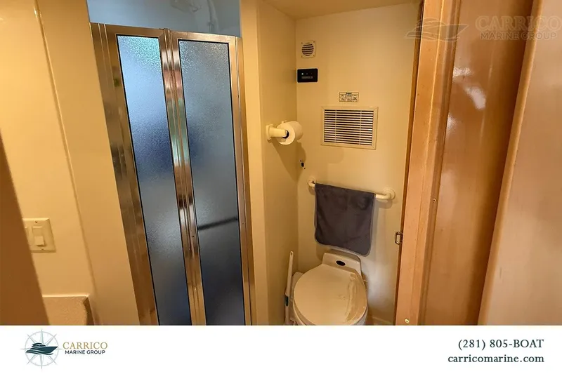Slide: The Image of Bathroom interior of 2000 Carver 350 Mariner yacht with shower and toilet. - 34
