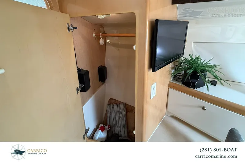 Slide: The Image of Interior of 2000 Carver 350 Mariner with TV, storage, and decorative plant. - 35