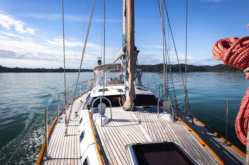 Slide: The Image of Sailing on a 2012 Hylas 56 yacht in calm waters under a clear blue sky. - 13