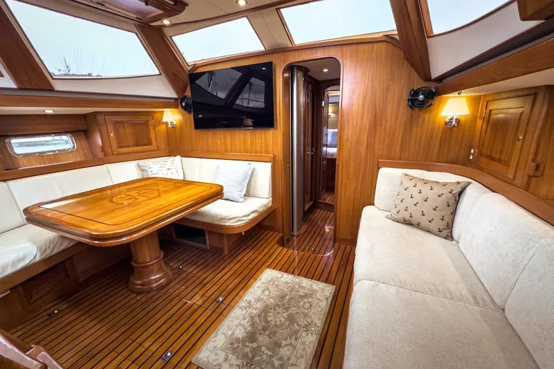 Slide: The Image of Luxurious interior of 2012 Hylas 56 yacht with elegant wood finish and cozy seating. - 20