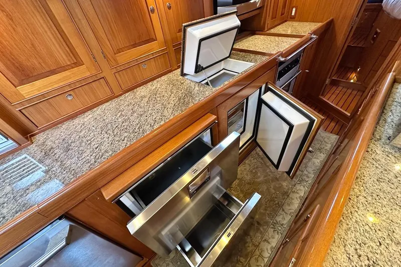 Slide: The Image of Luxurious Hylas 56 yacht kitchen with granite countertops and open stainless steel appliances, 2012 model. - 24