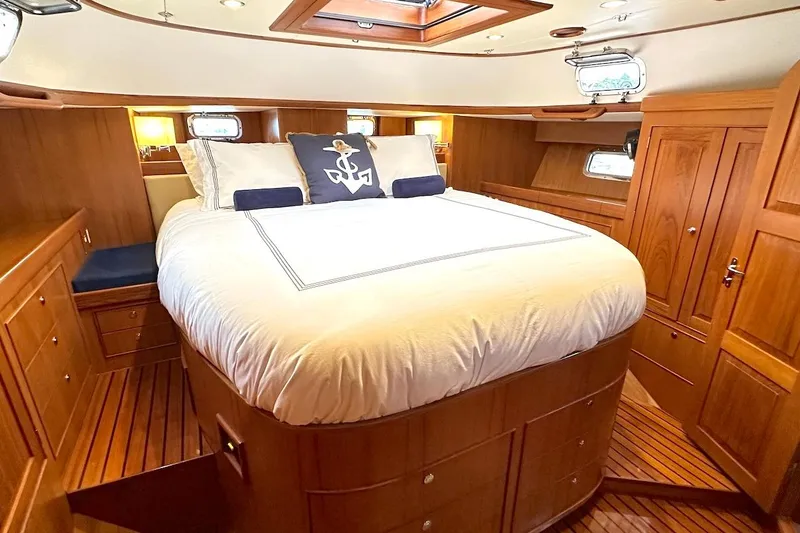 Slide: The Image of Luxurious cabin interior of a 2012 Hylas 56 yacht with elegant wood finish. - 29
