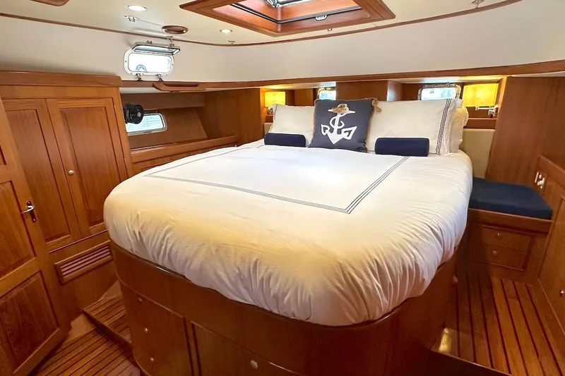 Slide: The Image of Luxurious cabin interior of a 2012 Hylas 56 yacht with elegant wood finish. - 30