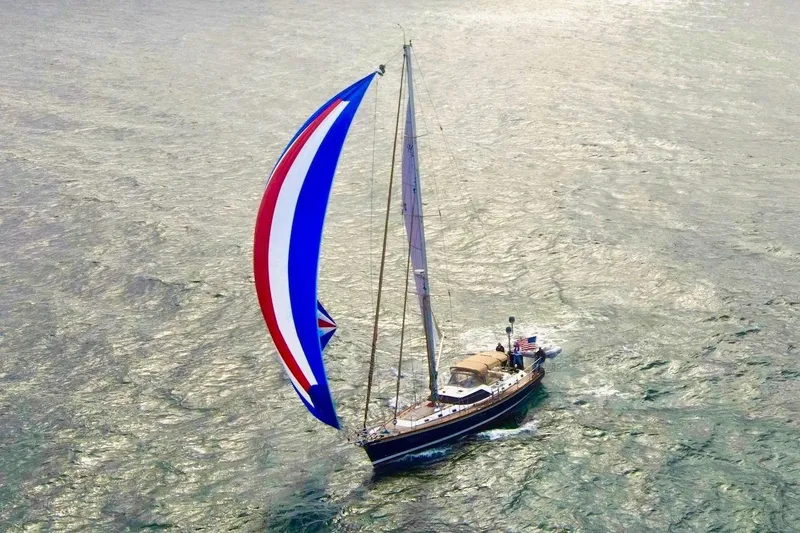 Slide: The Image of Sailing yacht Hylas 56 (2012) with colorful spinnaker on open water. - 4