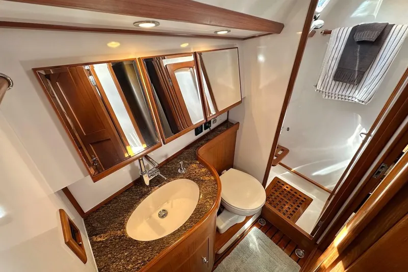 Slide: The Image of Luxurious bathroom in 2012 Hylas 56 yacht with granite countertop and wooden accents. - 42