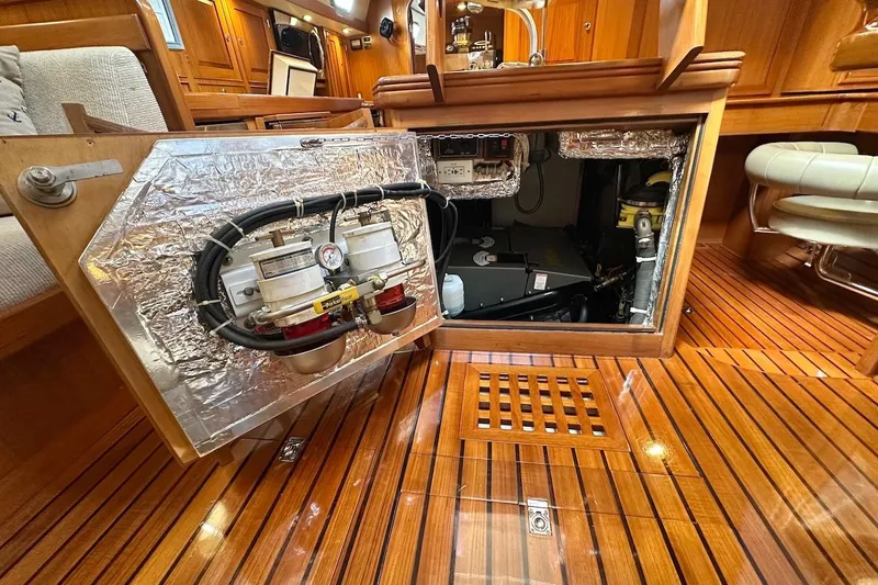 Slide: The Image of Engine compartment of a 2012 Hylas 56 yacht with wooden interior detailing. - 44