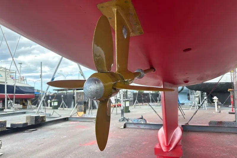 Slide: The Image of Propeller of 2012 Hylas 56 yacht in dry dock, showcasing hull and rudder. - 47