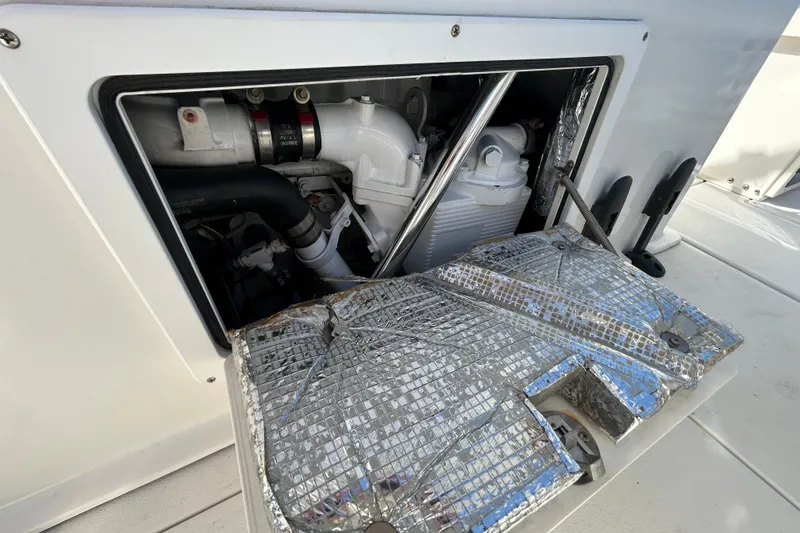 Slide: The Image of Engine compartment of a 2006 Albin 26 Center Console boat, showcasing mechanical components. - 19