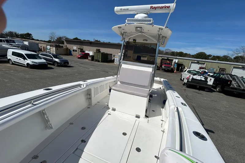 Slide: The Image of 2006 Albin 26 Center Console boat with Raymarine equipment, parked in a marina lot. - 22