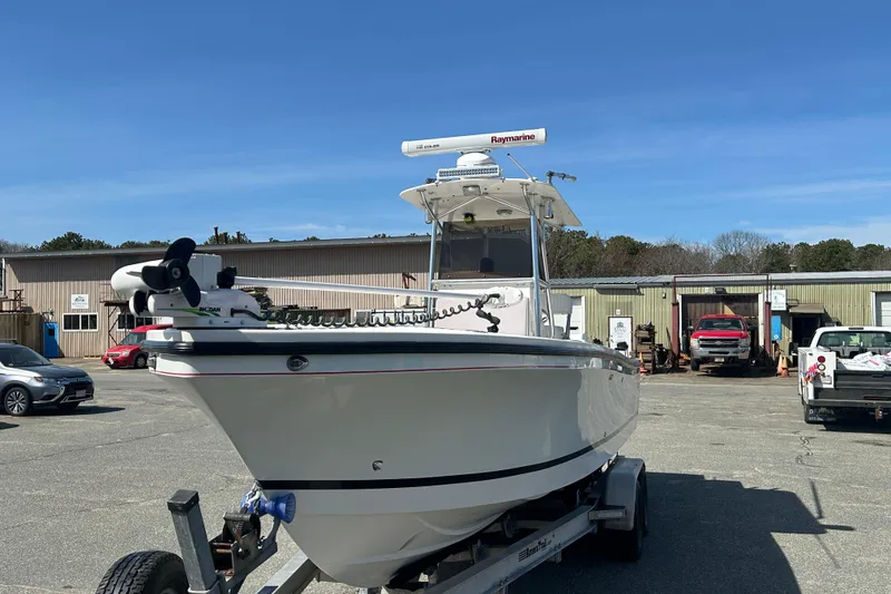Slide: The Image of 2006 Albin 26 Center Console boat on trailer in a parking lot. - 3
