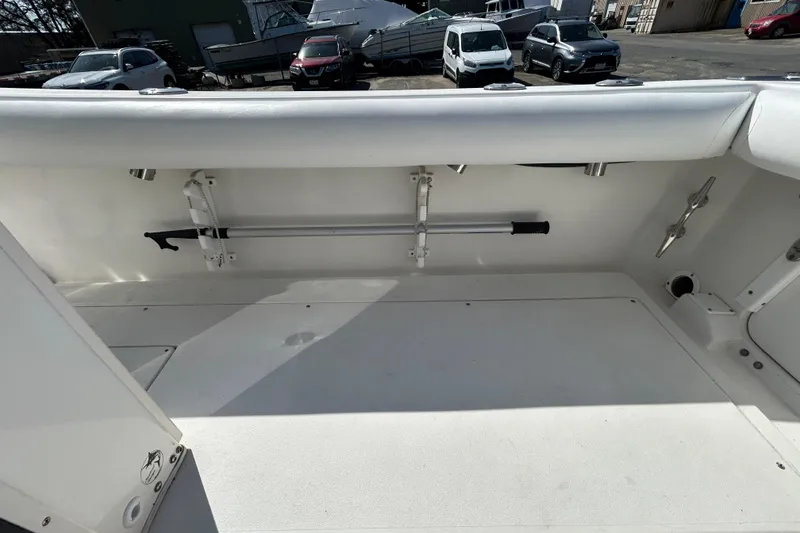 Slide: The Image of 2006 Albin 26 Center Console boat interior with rod holder and storage space. - 35