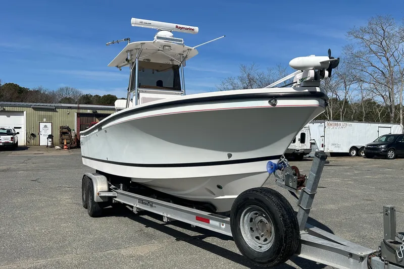 Slide: The Image of 2006 Albin 26 Center Console boat on trailer in outdoor setting. - 4