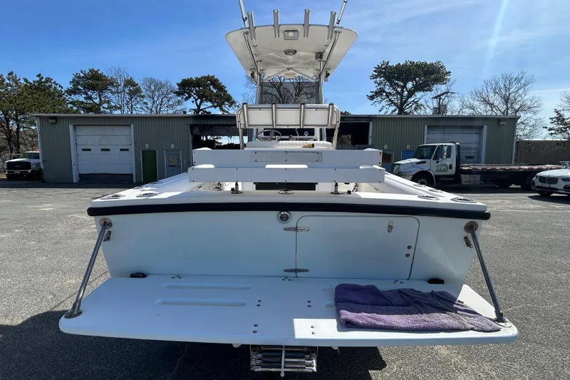 Slide: The Image of 2006 Albin 26 Center Console boat, rear view in a parking lot, sunny day. - 7