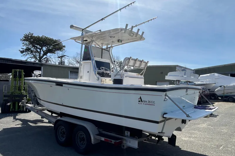 Slide: The Image of 2006 Albin 26 Center Console boat on trailer in outdoor storage area. - 8