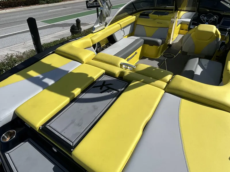 Slide: The Image of Interior of a yellow 2021 MasterCraft XT21 boat, modern seating. - 4