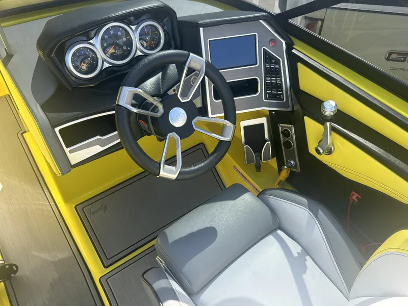 Slide: The Image of Interior of a 2021 MasterCraft XT21 boat with yellow accents. - 8