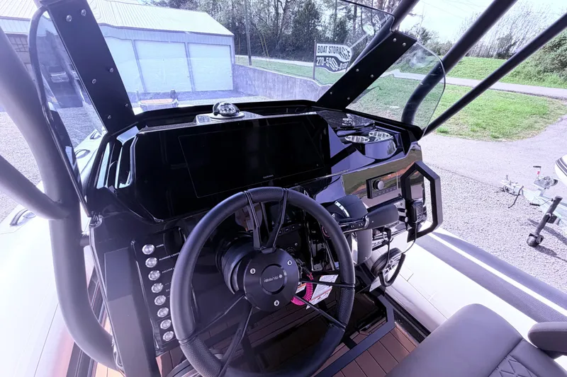 Slide: The Image of Interior view of 2026 Brig Eagle 8 boat cockpit with steering wheel and controls. - 3