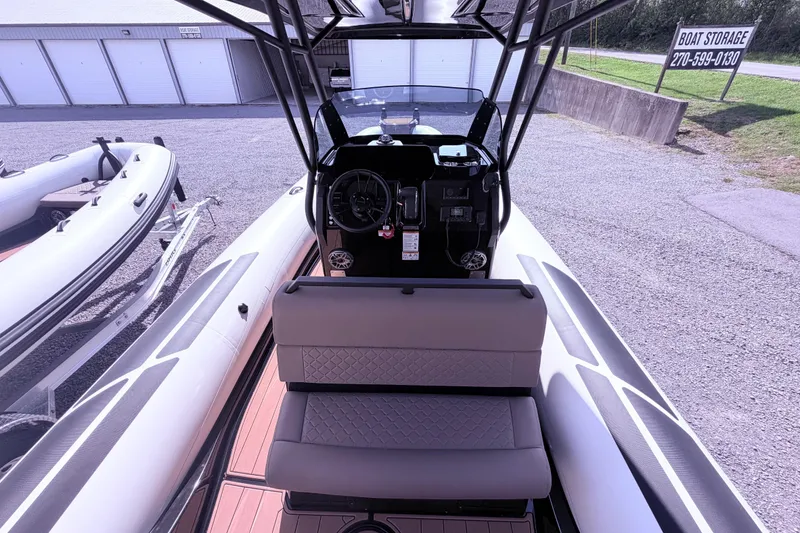Slide: The Image of Interior view of a 2026 Brig Eagle 8 boat with modern dashboard and seating. - 5