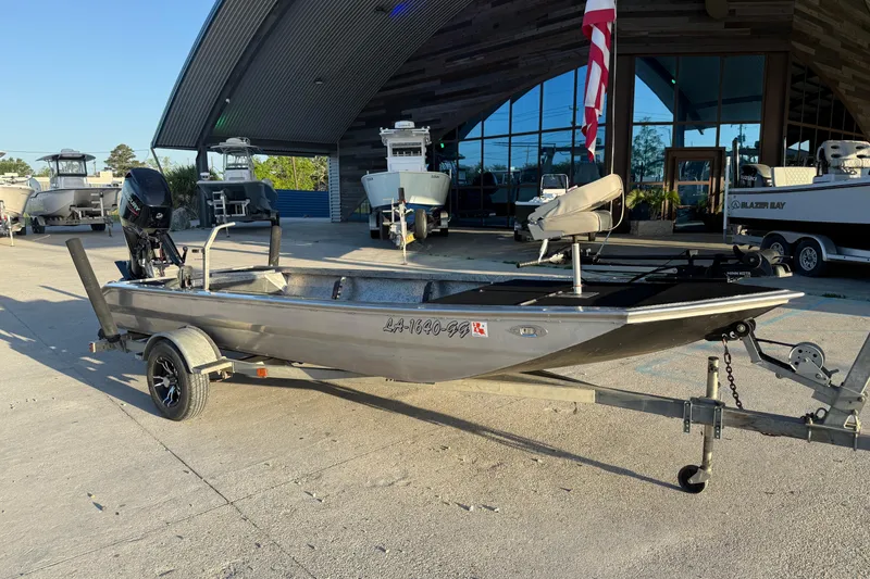 Slide: The Image of 2017 Homemade 1754 boat on trailer, parked outside a showroom. - 3
