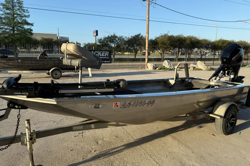 Slide: The Image of 2017 Homemade 1754 boat on trailer with Minn Kota motor, parked outdoors. - 6