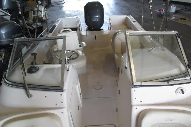 Slide: The Image of 2009 Grady-White Tournament 205 boat interior with seating and Yamaha engine. - 11