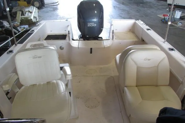 Slide: The Image of 2009 Grady-White Tournament 205 boat interior with Yamaha 200 engine, featuring two white seats. - 14