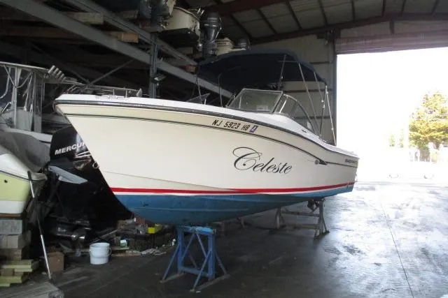Slide: The Image of 2009 Grady-White Tournament 205 boat named "Celeste" in storage, side view. - 23
