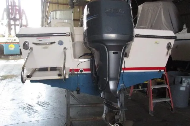 Slide: The Image of 2009 Grady-White Tournament 205 boat with Yamaha outboard motor in a storage facility. - 25