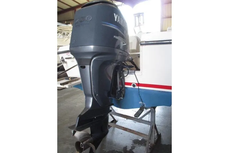 Slide: The Image of 2009 Grady-White Tournament 205 with Yamaha outboard motor in a garage setting. - 4