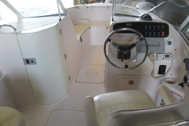 Slide: The Image of 2009 Grady-White Tournament 205 boat interior with steering wheel and Garmin navigation system. - 5