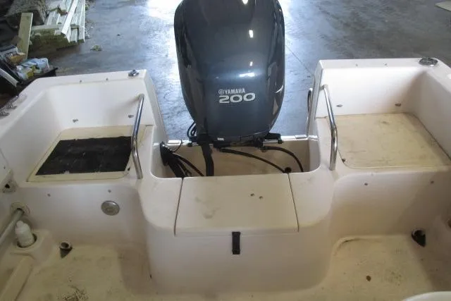 Slide: The Image of 2009 Grady-White Tournament 205 boat with Yamaha 200 engine in a garage setting. - 6