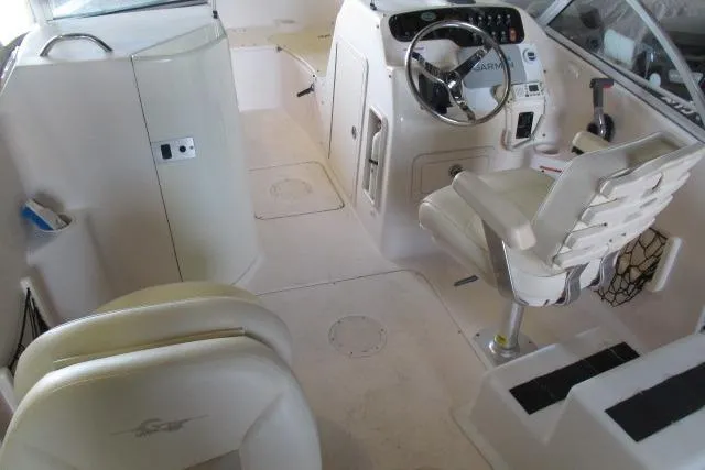 Slide: The Image of 2009 Grady-White Tournament 205 boat interior with steering wheel and seating. - 7
