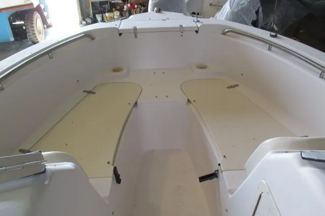 Slide: The Image of 2009 Grady-White Tournament 205 boat interior with seating and storage compartments. - 9