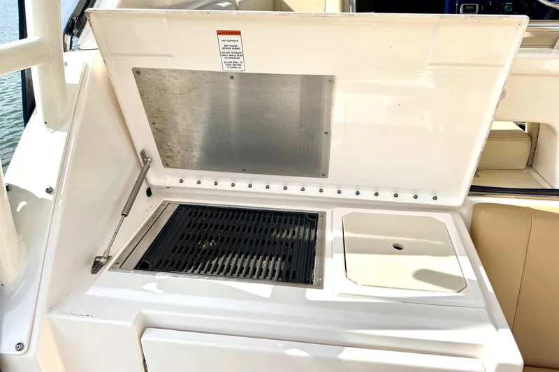 Slide: The Image of Outdoor grill and sink on a 2016 Pursuit OS 325 Offshore boat. - 22