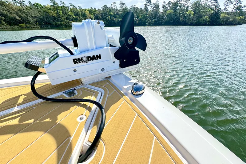 Slide: The Image of 2016 Pursuit OS 325 Offshore boat with Rhodan trolling motor on a sunny lake. - 27