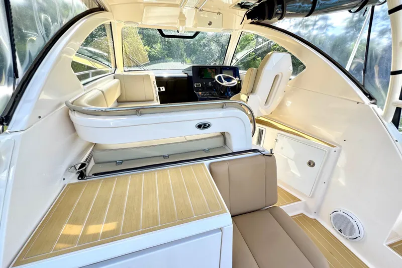 Slide: The Image of Interior of 2016 Pursuit OS 325 Offshore boat with modern helm and seating. - 30