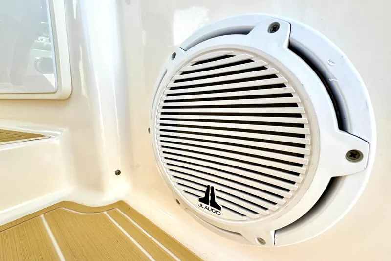 Slide: The Image of Speaker on 2016 Pursuit OS 325 Offshore boat, featuring JL Audio branding. - 31