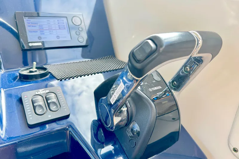 Slide: The Image of 2016 Pursuit OS 325 Offshore boat controls with Yamaha throttle and display. - 37