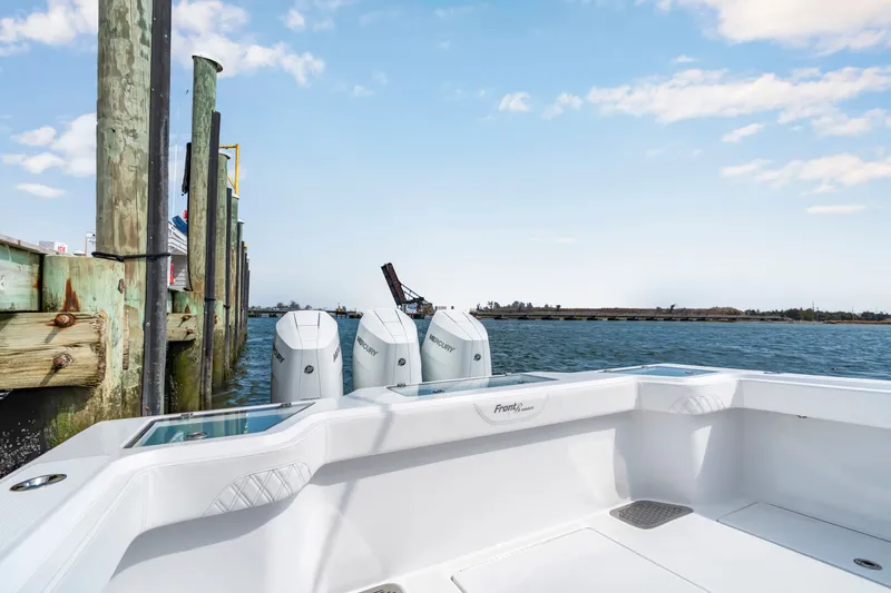 Slide: The Image of Front Runner 39 Center Console 2026 at dock with outboard engines. - 19