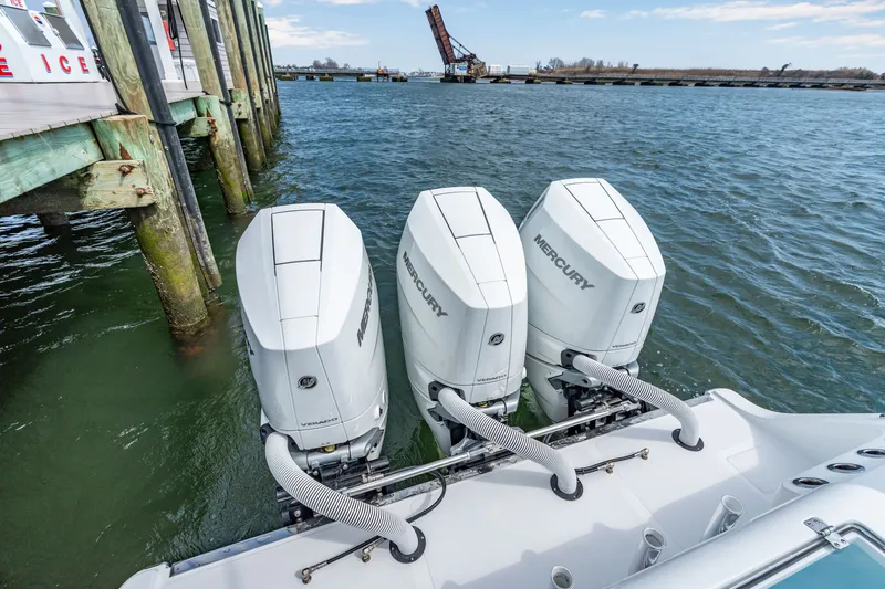 Slide: The Image of 2026 Front Runner 39 Center Console with three Mercury engines at dock. - 25