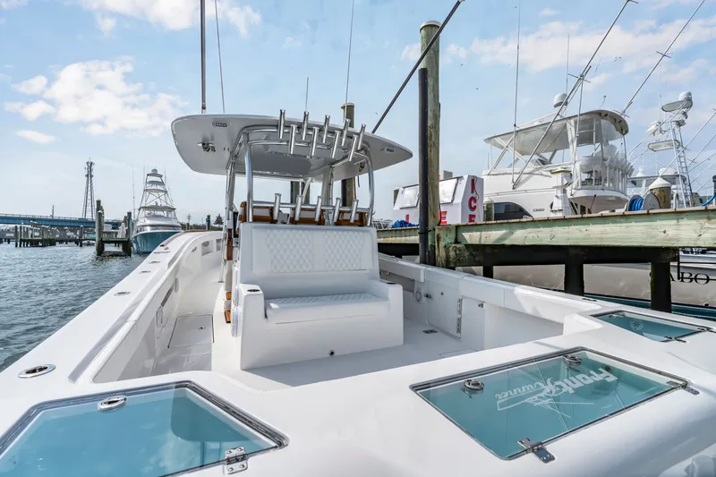 Slide: The Image of 2026 Front Runner 39 Center Console at dock, modern design. - 36