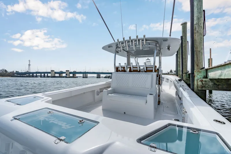 Slide: The Image of Front Runner 39 Center Console 2026 on water, with bridge in background. - 38