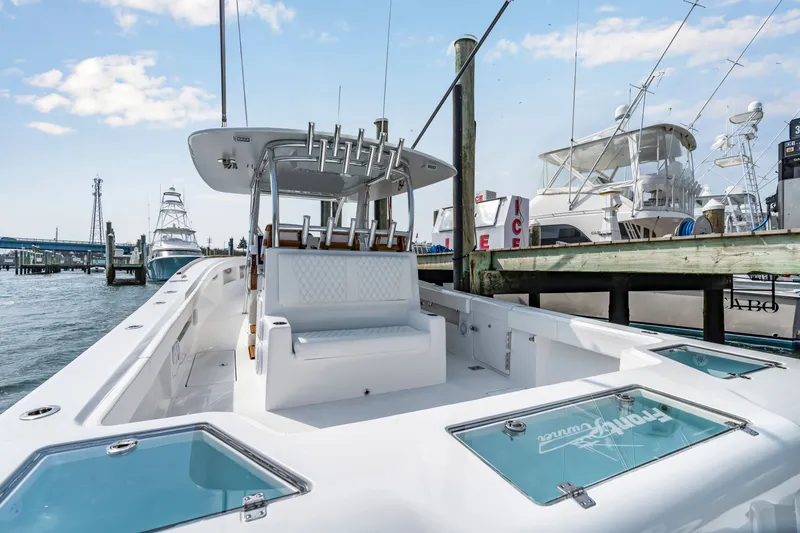 Slide: The Image of 2026 Front Runner 39 Center Console at dock, modern design. - 39