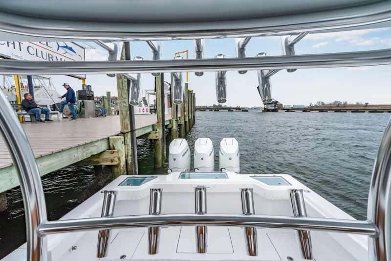 Slide: The Image of Front Runner 39 Center Console 2026 at dock with three outboard engines. - 44