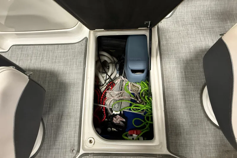 Slide: The Image of Storage compartment of 2019 Chaparral Vortex 2430 VRX Wake Series boat with ropes and equipment. - 10