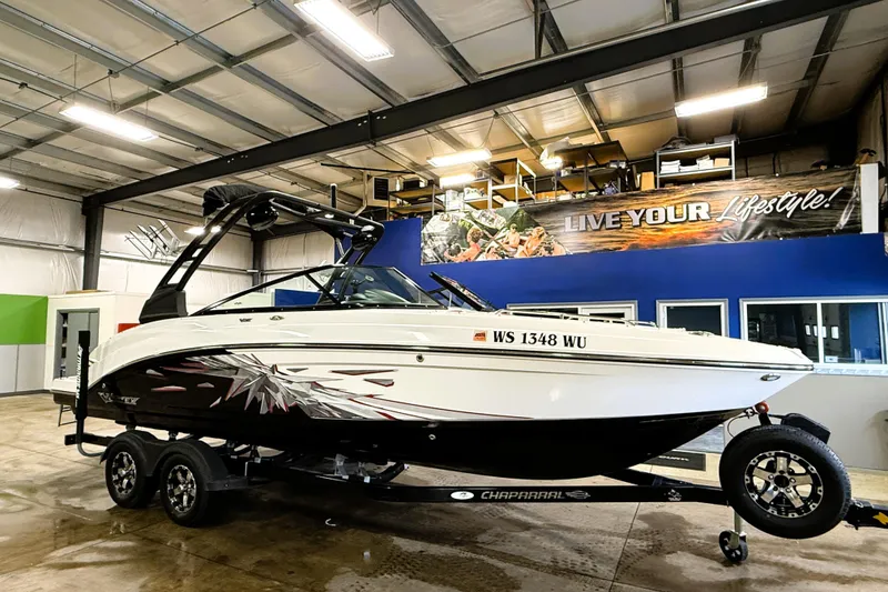 Slide: The Image of 2019 Chaparral Vortex 2430 VRX Wake Series boat in showroom, on trailer. - 2